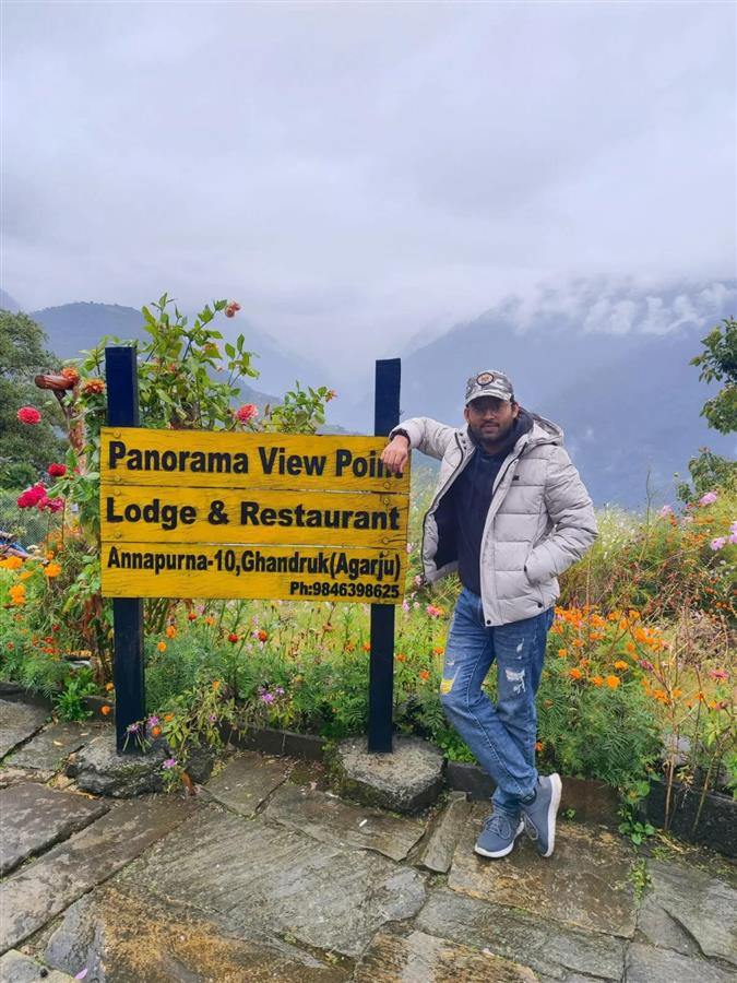 Standing by the Panorama View Point sign in Ghandruk, Annapurna, Nepal